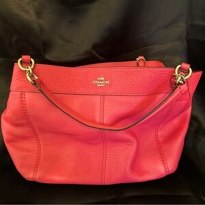 Gently used pink Coach handbag. No visible wear.